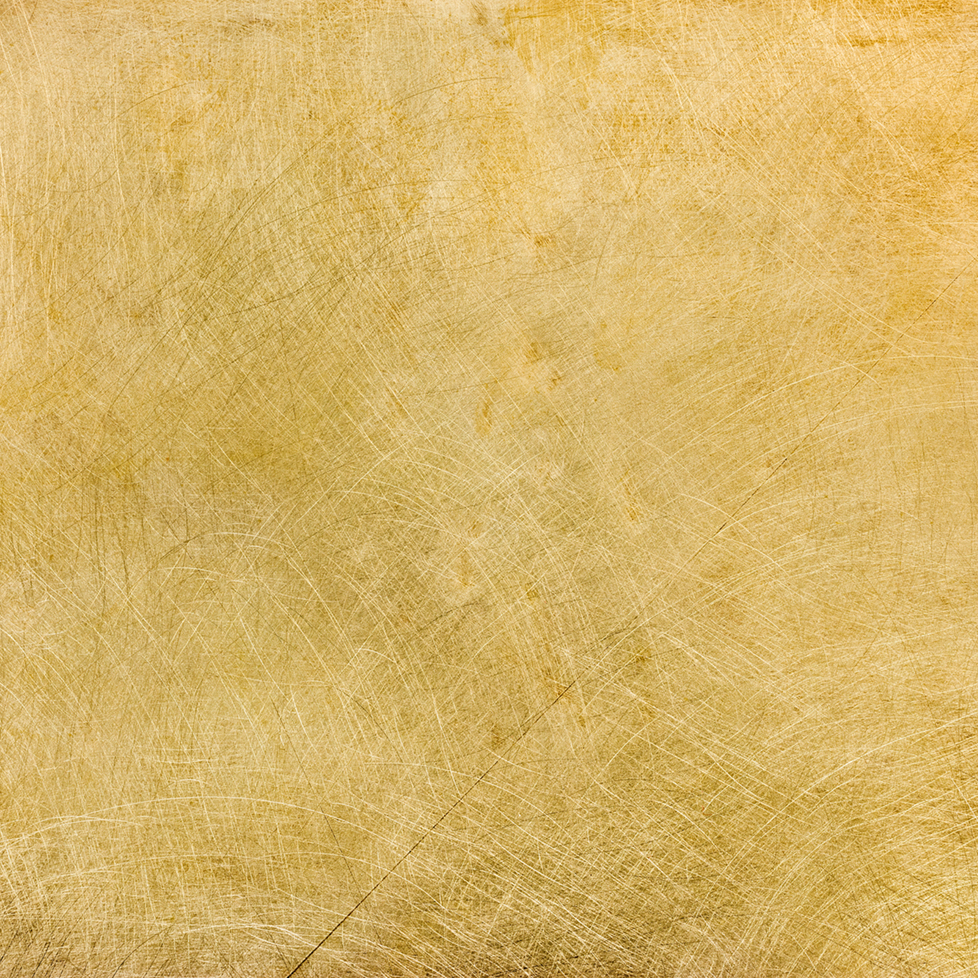 industrial brushed brass plate with multiple scratches backgroun Pittella